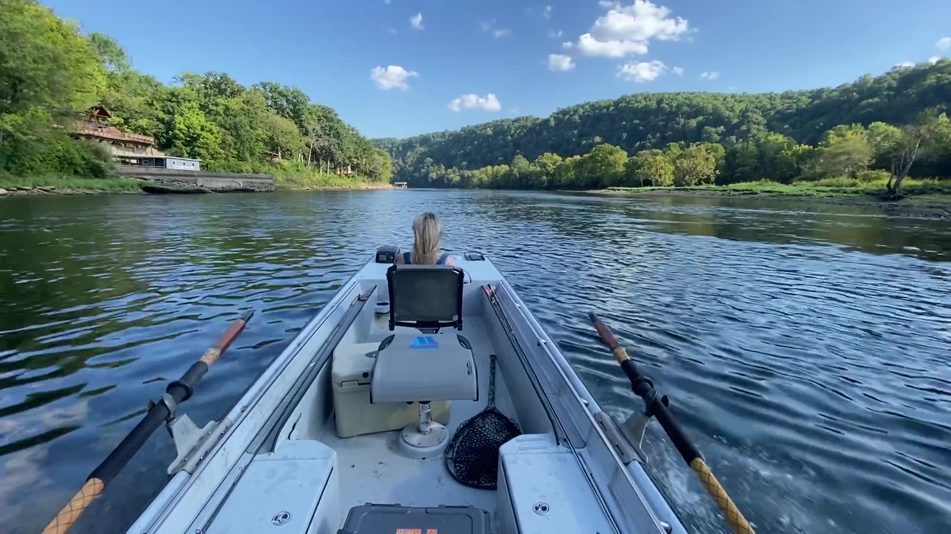 Running upriver by guide boat on an Arkansas tailwater